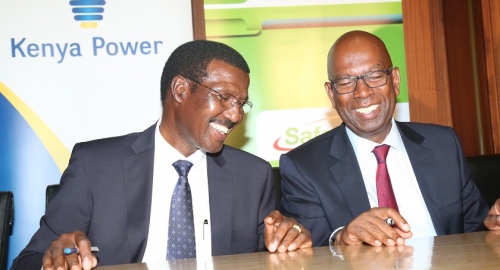 Dr. Chumo shares a light moment with safaricom CEO Bob Collymore during signing of M.O.U 